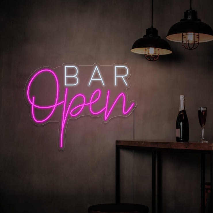 hot pink open bar neon sign hanging on bar wall