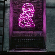 hot pink street cred neon sign hanging on bar wall