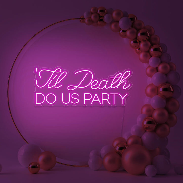 hot pink til death do us party neon sign in gold hoop backdrop with balloons