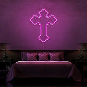 hot pink tupac cross neon sign hanging on bedroom wall