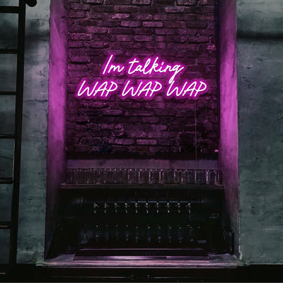 hot pink im talking wap wap wap neon sign hanging on bar wall