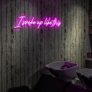 pink I woke up like this beauty neon sign hanging on hair salon wall