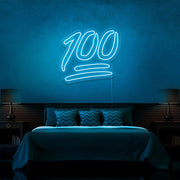 ice blue 100 neon sign hanging on bedroom wall