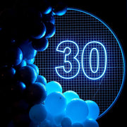 ice blue 30 neon sign hanging on backdrop frame with balloons