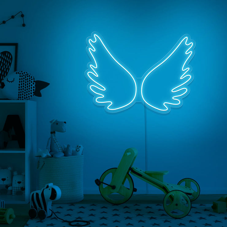 ice blue angel wings neon sign hanging on kids bedroom wall