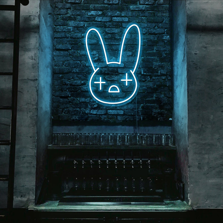 ice blue bad bunny neon sign hanging on bar wall