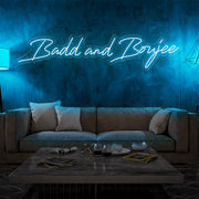 ice blue bad and boujee neon sign hanging on living  room wall