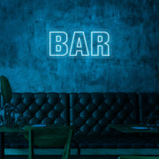 ice blue bar neon sign hanging on bar wall