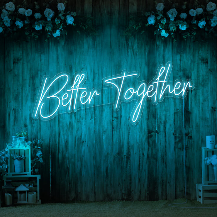 iice blue better together neon sign hanging on timber wall