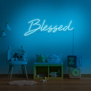ice blue blessed neon sign hanging on kids bedroom wall