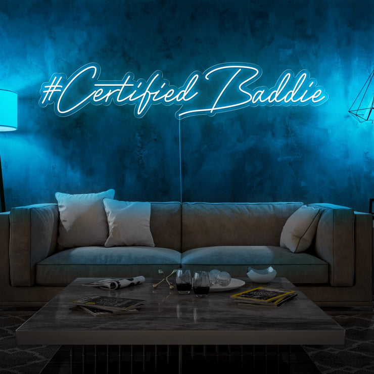 ice blue certified baddie neon sign hanging on living room wall