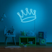 ice blue crown neon sign hanging on kids bedroom wall