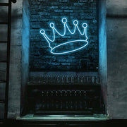 ice blue crown neon sign hanging on bar wall