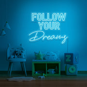 ice blue follow your dreams neon sign hanging on kids bedroom wall