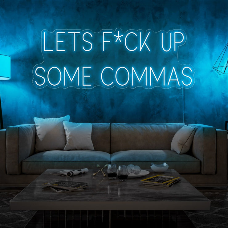 ice blue lets fuck up commas neon sign hanging on living room wall