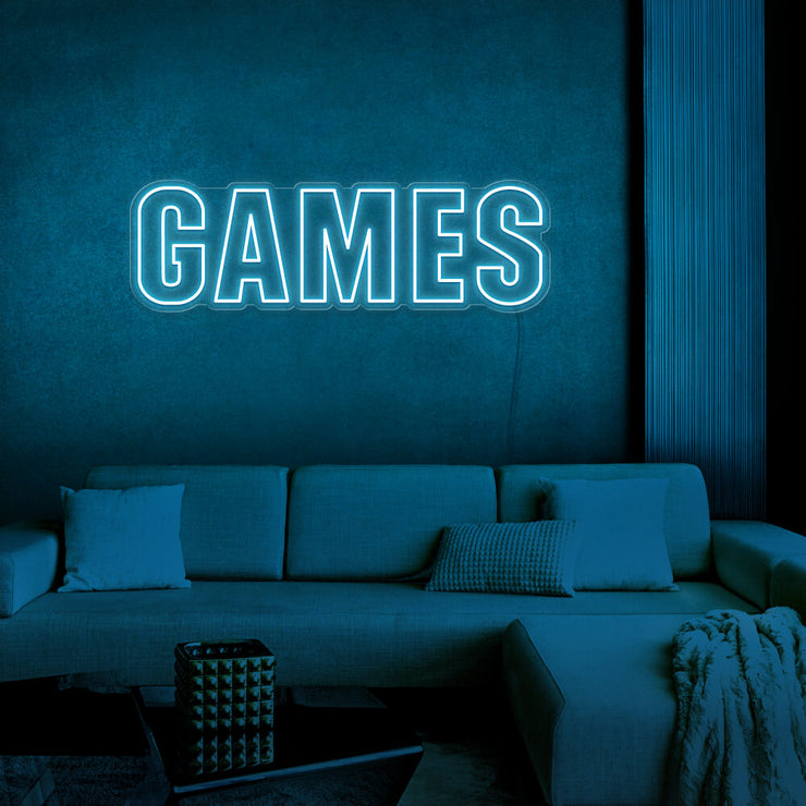 ice blue games neon sign hanging on games room wall