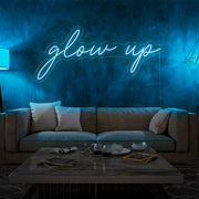 ice blue glow up neon sign hanging on living room wall