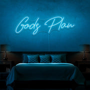ice blue gods plan neon sign hanging on bedroom wall