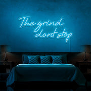 ice blue the grind dont stop neon sign hanging on bedroom wall