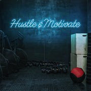 ice blue hustle and motivate neon sign hanging on gym wall