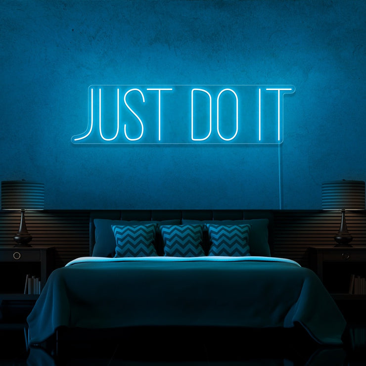 ice blue just do it neon sign hanging on bedroom wall