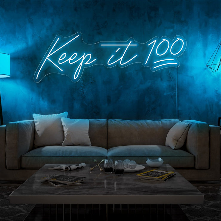 ice blue keep it 100 neon sign hanging on living room wall