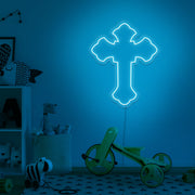 ice blue cross neon sign hanging on kids bedroom wall