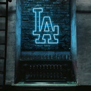 ice blue LA neon sign hanging on bar wall