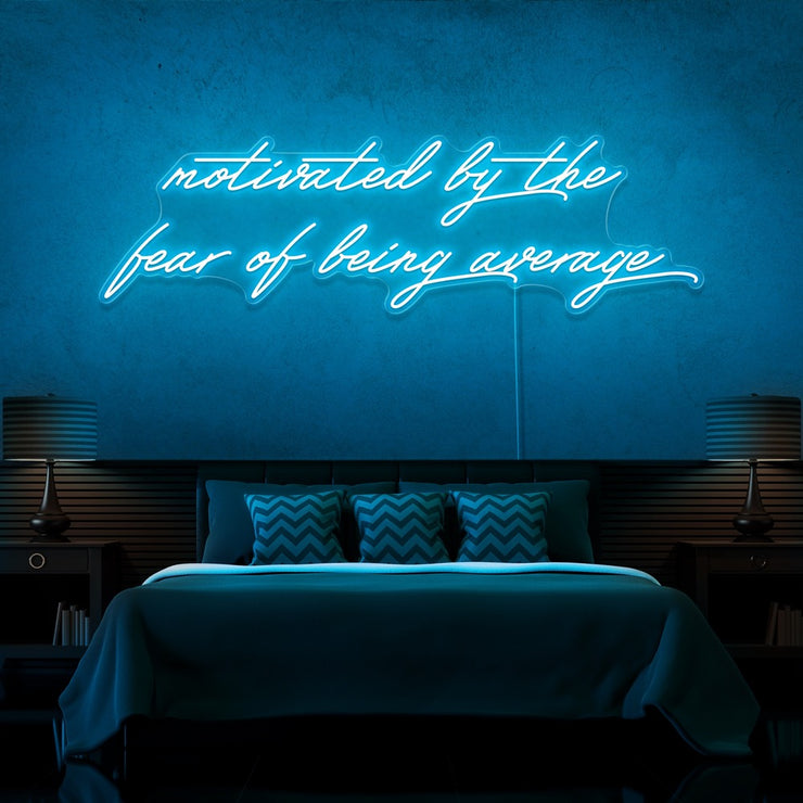 ice blue motivated by the fear of being average neon sign hanging on bedroom wall
