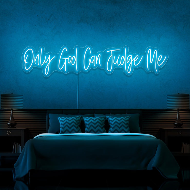 ice blue only god can judge me neon sign hanging on bedroom wall
