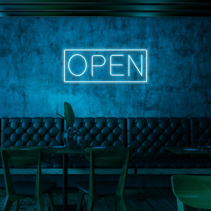 ice blue open neon sign hanging on cafe wall