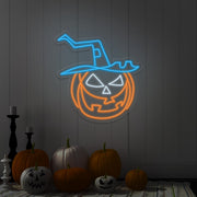 ice blue pumpkin hat neon sign hanging on wall next to pumpkins