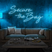 ice blue secure the bag neon sign hanging on living room wall