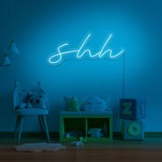 ice blue shh neon sign hanging on kids bedroom wall
