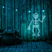 ice blue skeleton neon sign hanging on timber fence