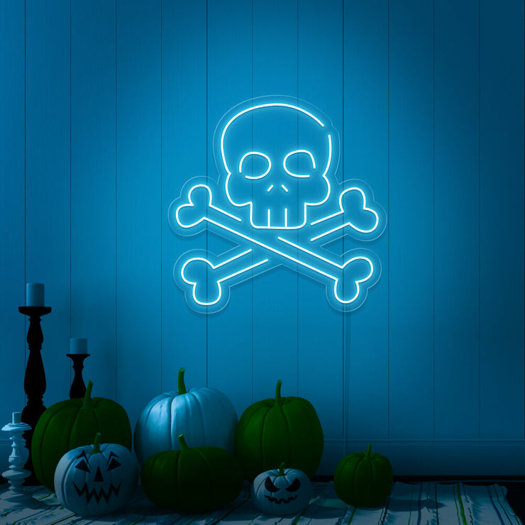ice blue skull bones neon sign with pumpkins on floor