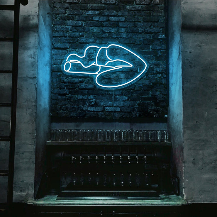 ice blue smoking lips neon sign hanging on bar wall