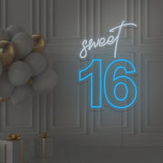 ice blue sweet 16 neon sign hanging on wall