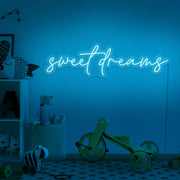ice blue sweet dreams neon sign hanging on kids bedroom wall
