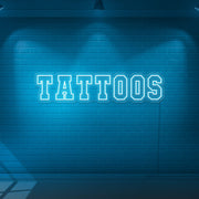 ice blue tattoos neon sign hanging on wall