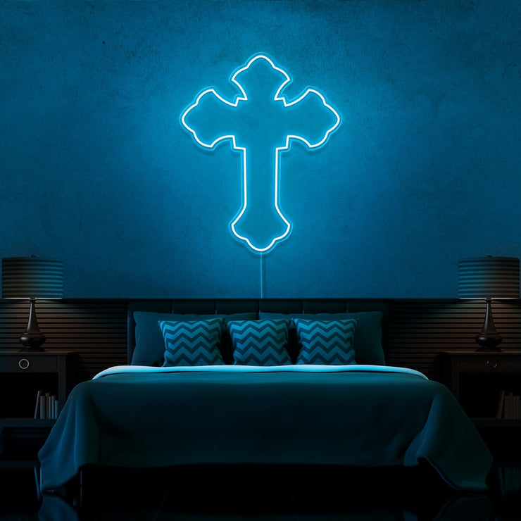 ice blue tupac cross neon sign hanging on bedroom wall