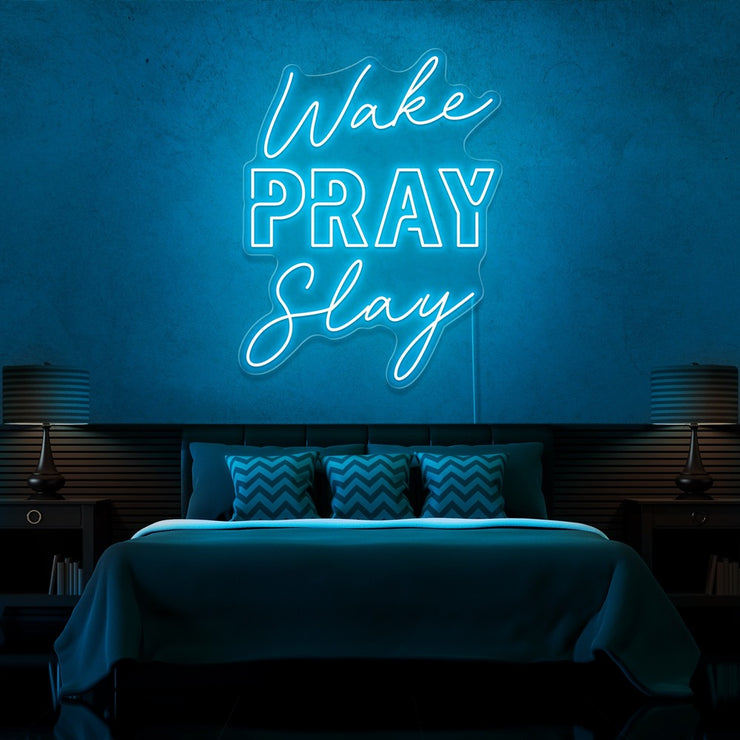 ice blue wake pray slay neon sign hanging on bedroom wall