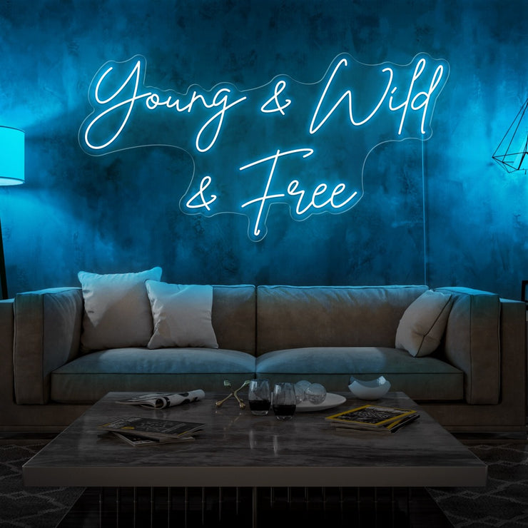 ice blue young and wild and free neon sign hanging  on living room wall