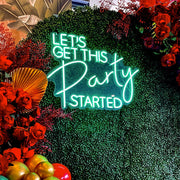 close up of lets get this party started neon sign 