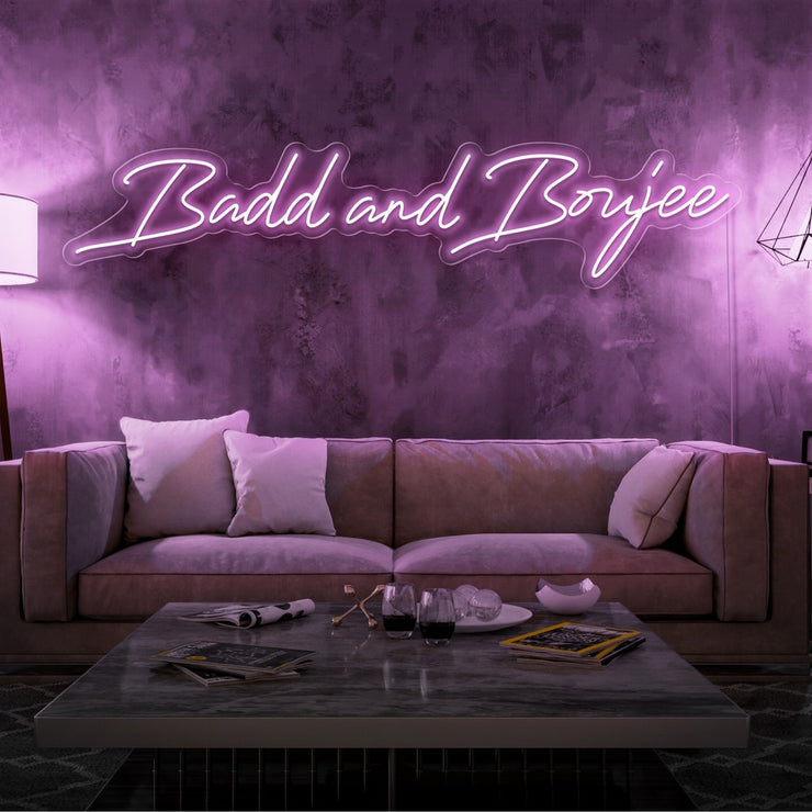 light pink bad and boujee neon sign hanging on living  room wall