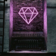 light pink diamond neon sign hanging on bar wall