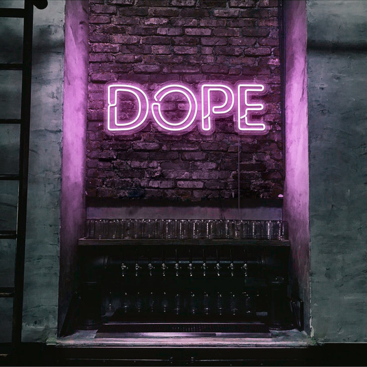light pink dope neon sign hanging on bedroom wall