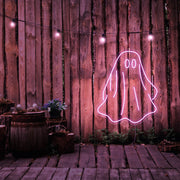 light pink draped ghost neon sign hanging on timber wall