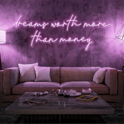 light pink dreams worth more than money neon sign hanging on living  room wall
