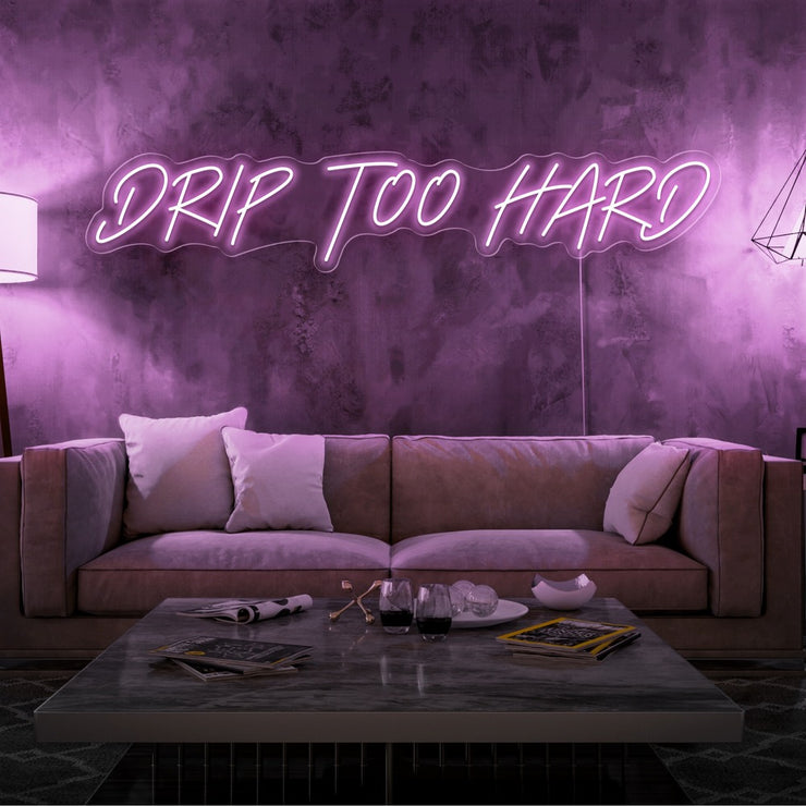 light pink drip too hard neon sign hanging on living room wall